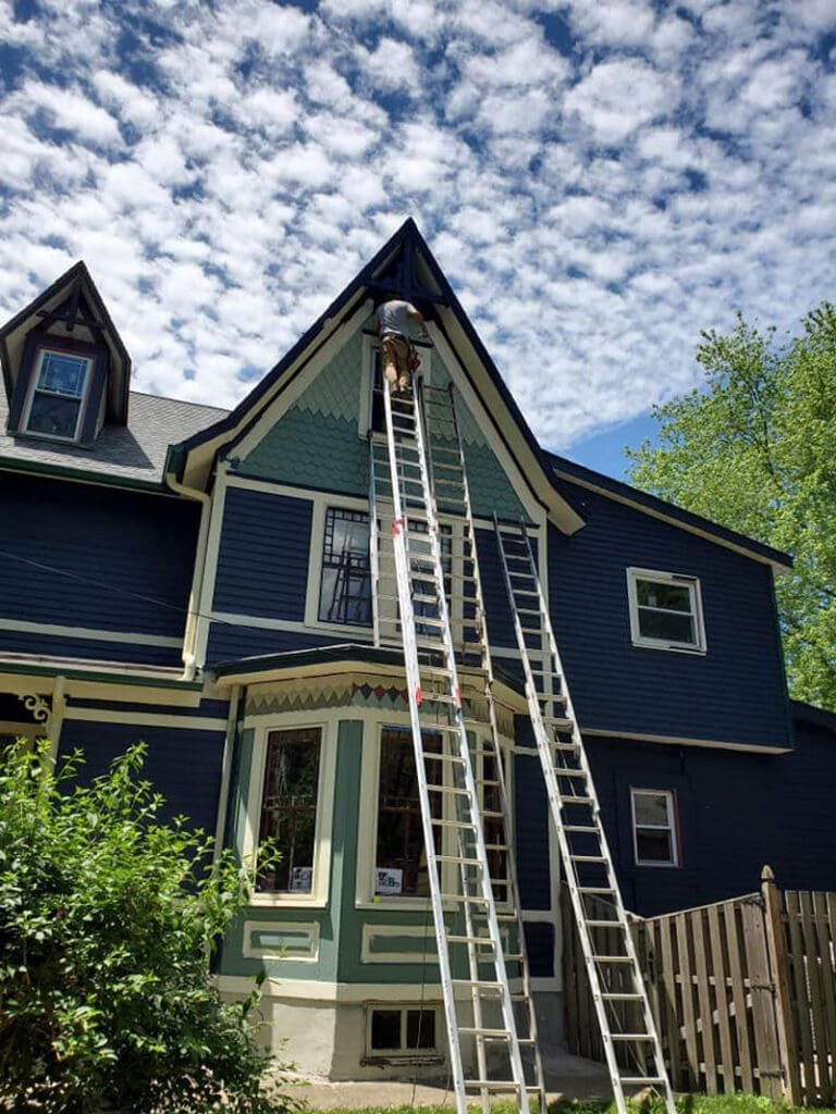 Tango-After-Shot-1 Home's exterior being painted by A Woman's Brush